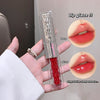 Lip gloss with packaging held in hand, showing matte and mirror finishes on lips.