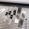 GEGE BEAR products including vials and packaging on a metallic surface