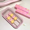 Pink and yellow bear-shaped containers in a wire basket with 'Gege bear' packaging.
