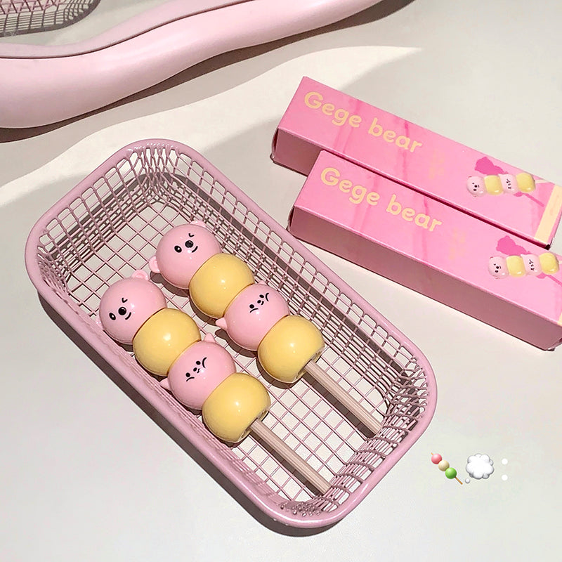 Pink and yellow bear-shaped containers in a wire basket with 'Gege bear' packaging.