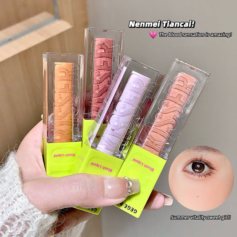 Set of colorful lip glosses in packaging held by a person, with an inset of an eye.