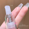 Lip balm with a clear container held between fingers against a brown background