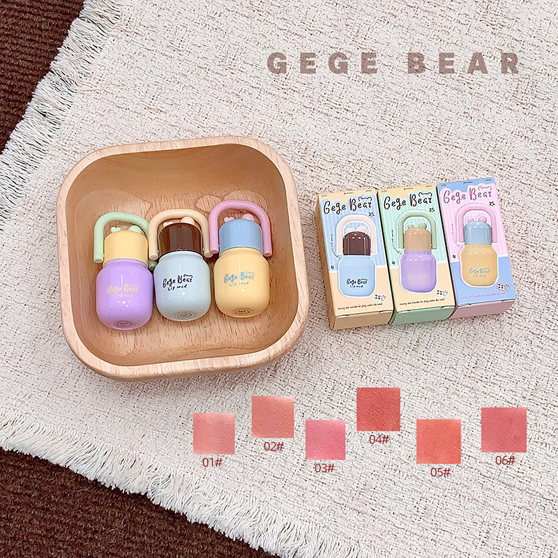 Colorful baby teether set with packaging on a textured surface, featuring the brand 'GEGE BEAR'.