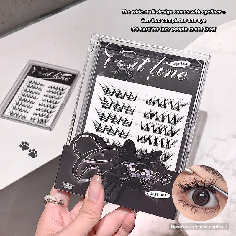 Eyelash packaging with false eyelashes and a cat illustration, held by a hand.