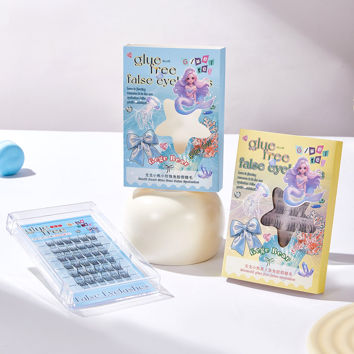 False eyelashes with packaging featuring mermaid design on a white background