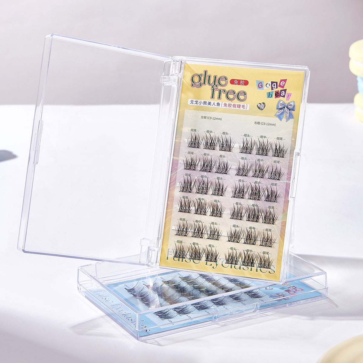 Eyelash extension set with a clear stand on a white background