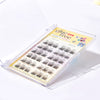 Set of false eyelashes in a clear case with a colorful label on a white background