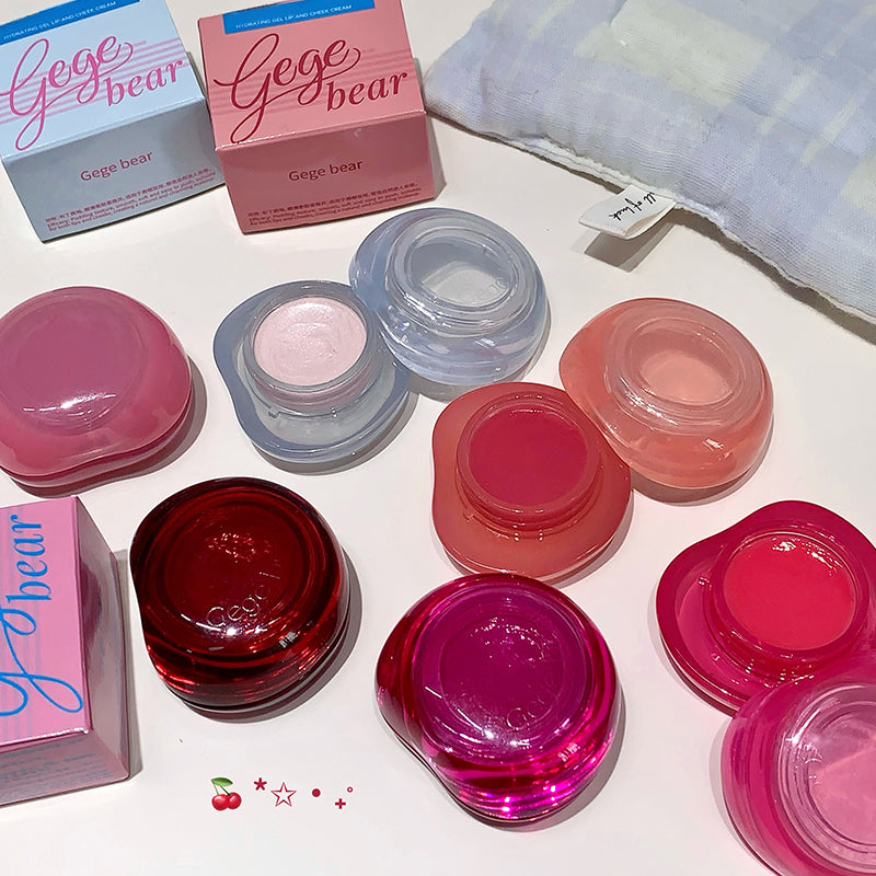 Set of small containers with lids, some labeled 'Gege bear', on a light surface.