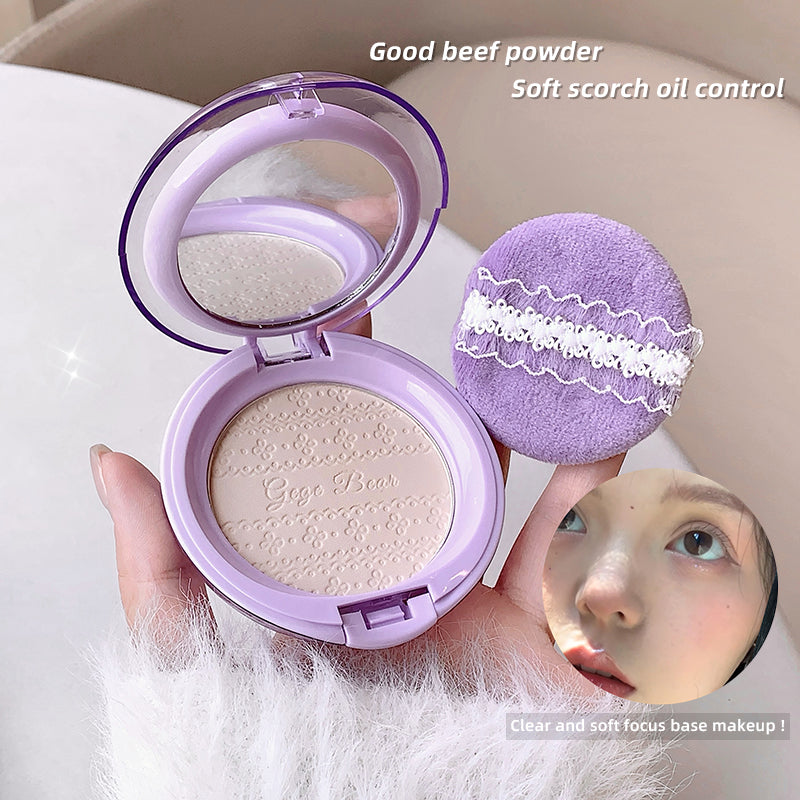 Purple compact powder with a mirror held by a hand, labeled 'Good beef powder' with text about oil control.