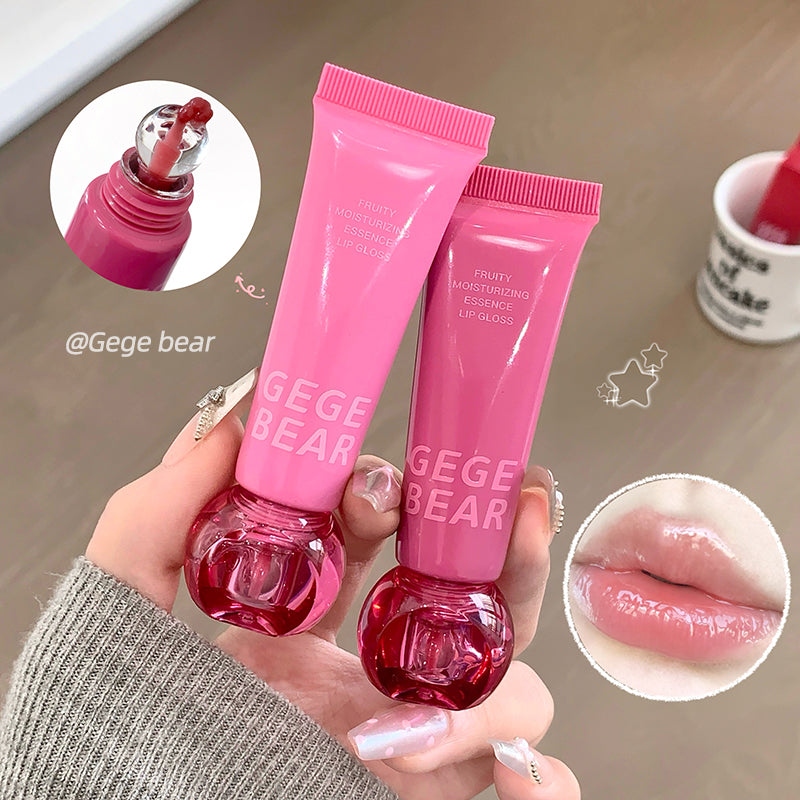 Two pink lip gloss tubes held by a hand with close-up insets of the product and lips.