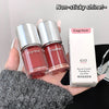 Two Gege bear lip gloss bottles and their packaging held by a hand.