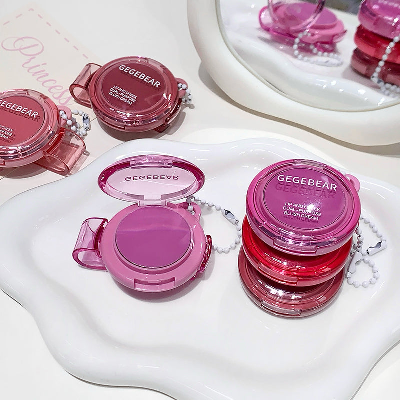 Pink blush cream containers with 'GEGEBEAR' branding on a white surface.