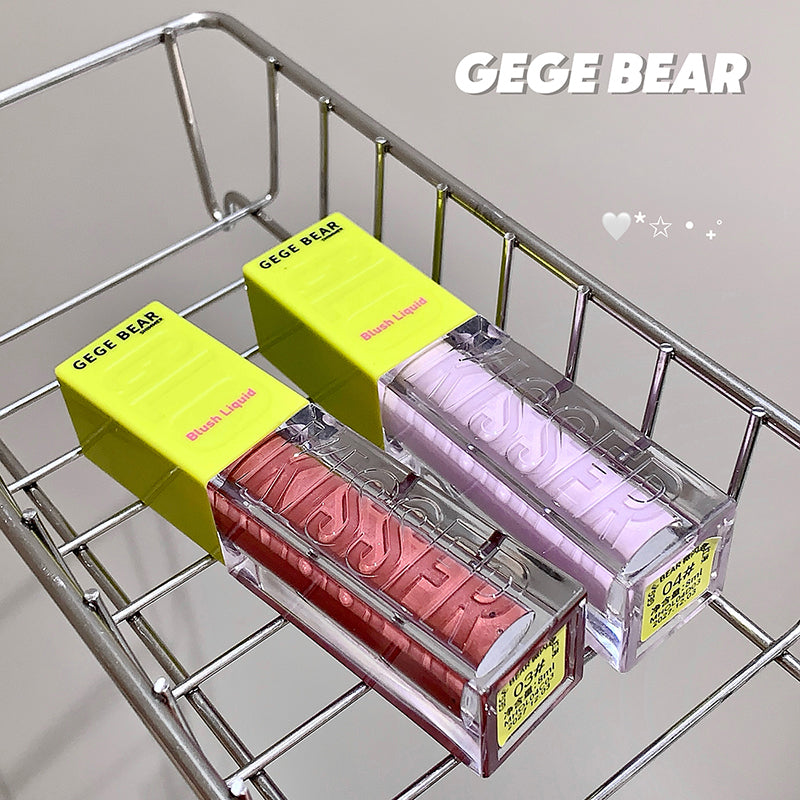 Two lip glosses in yellow and pink cases on a metal rack with 'GEGE BEAR' branding.