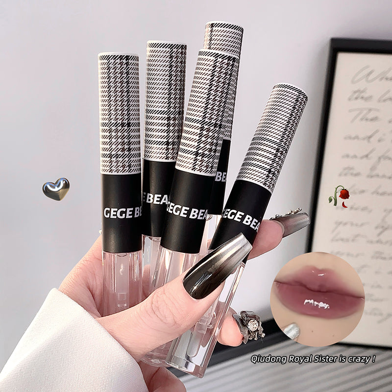 Four black and white patterned lip glosses with 'GECE BEA' branding, held by a hand.