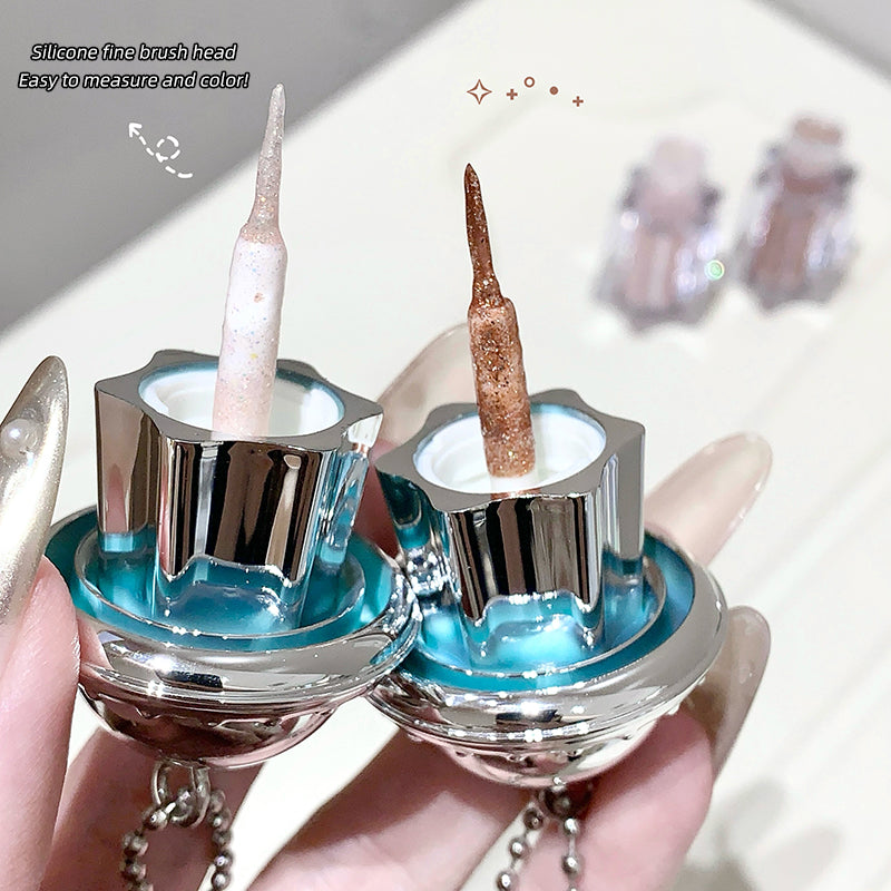 Two nail polish bottles with silicone brush heads on a light background