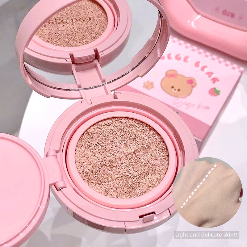 Pink compact powder with a bear design on the packaging