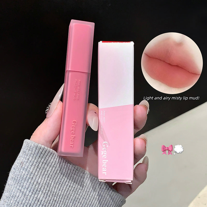 Two lip products held by a hand with a close-up of lips and text on a black background.