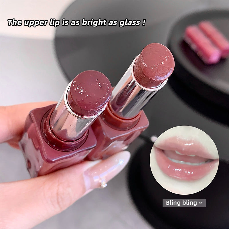 Lipstick being held with a close-up of lips wearing the lipstick, text 'The upper lip is as bright as glass!' and 'Bling bling'.