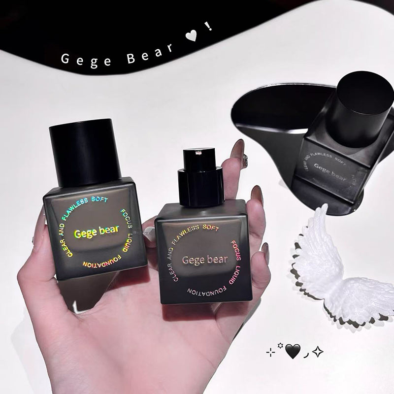 Two Gege Bear perfume bottles held by a hand on a white background