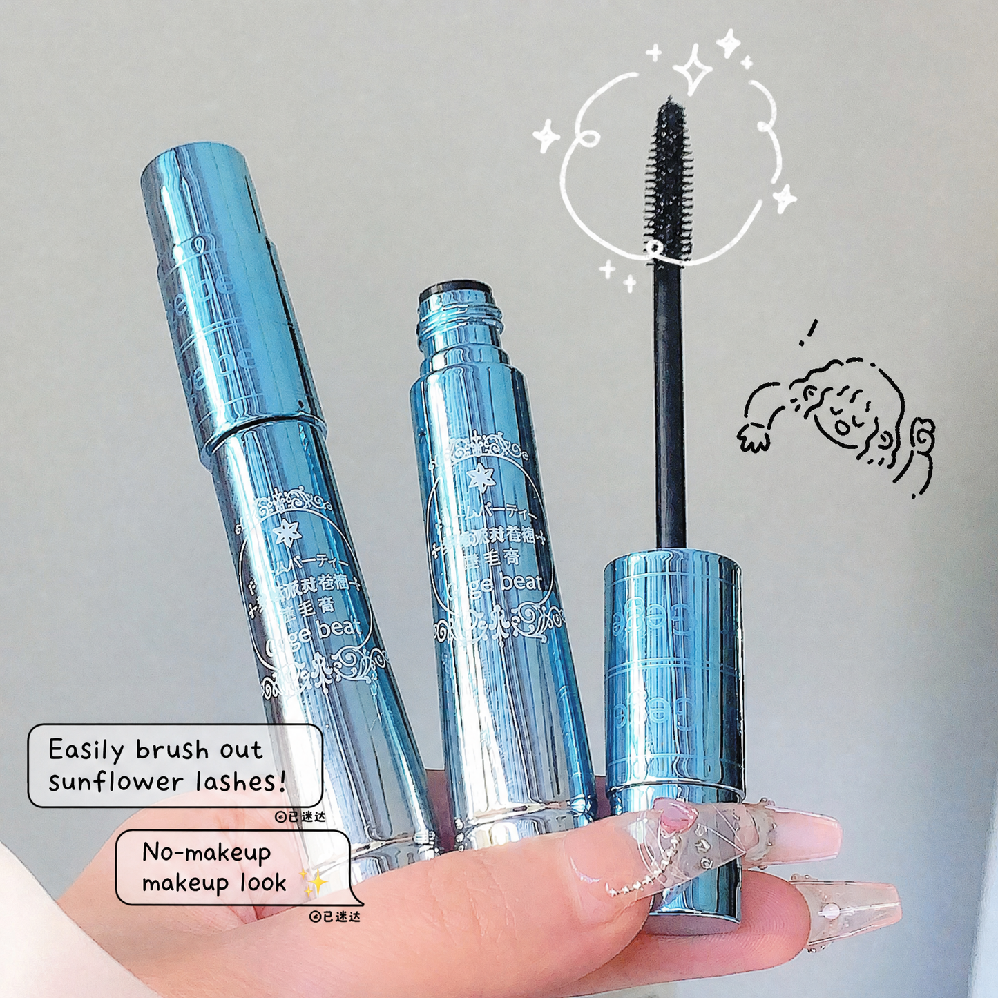 Blue mascara with a hand holding it against a neutral background