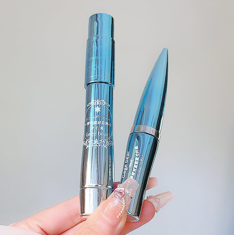 Two blue and silver cosmetic products held by a hand against a light gray background