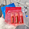 Three lip glosses in a clear packaging with 'Gege Bear' branding, held against a blurred background.