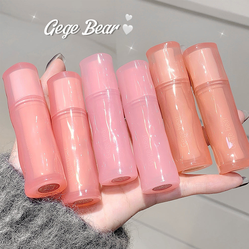 Set of pink lip balms on a hand with 'Gege Bear' branding.