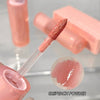 Pink lip gloss with applicator and swatch on a light gray background