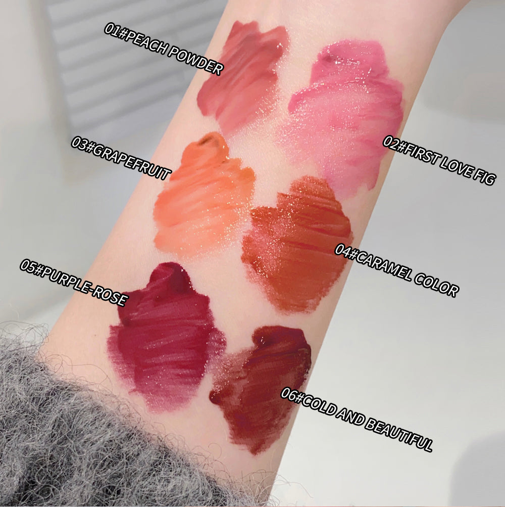 Lipstick swatches on a person's arm with color names labeled.