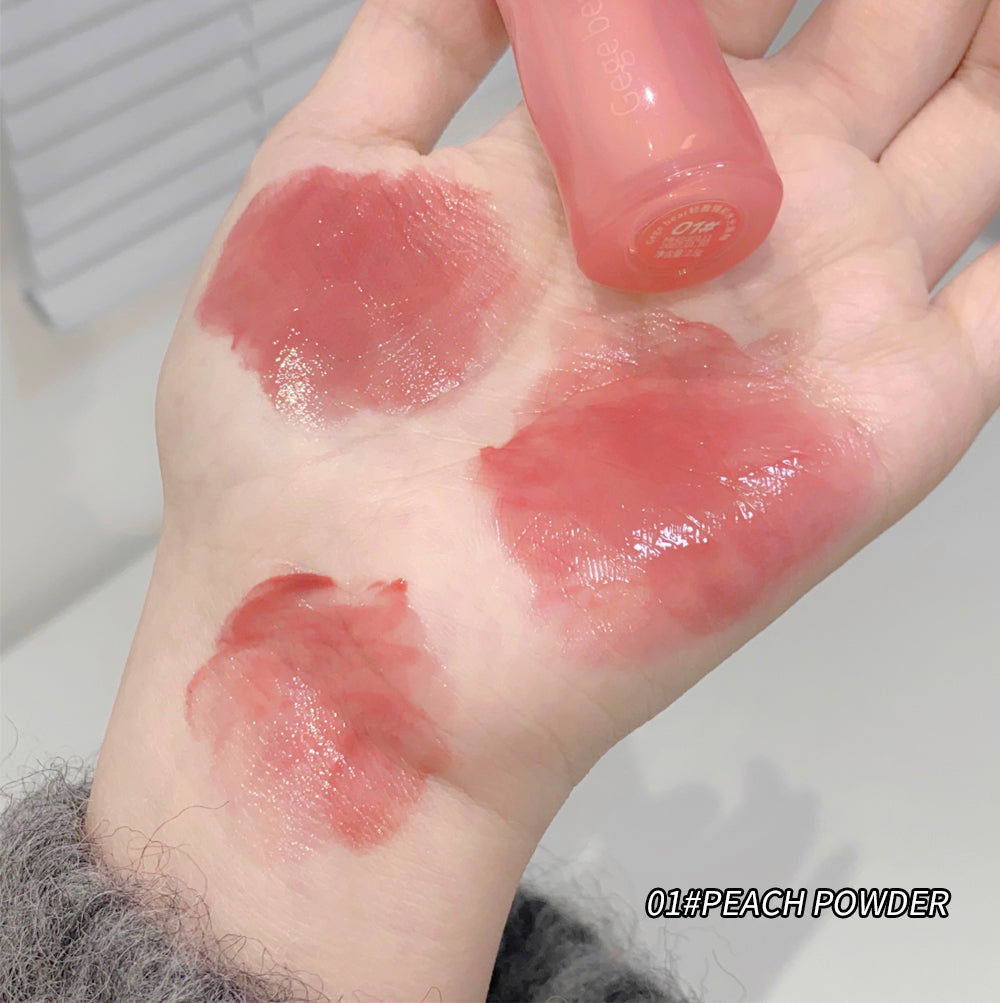 Hand with lipstick swatches labeled '01# Peach Powder' on a neutral background