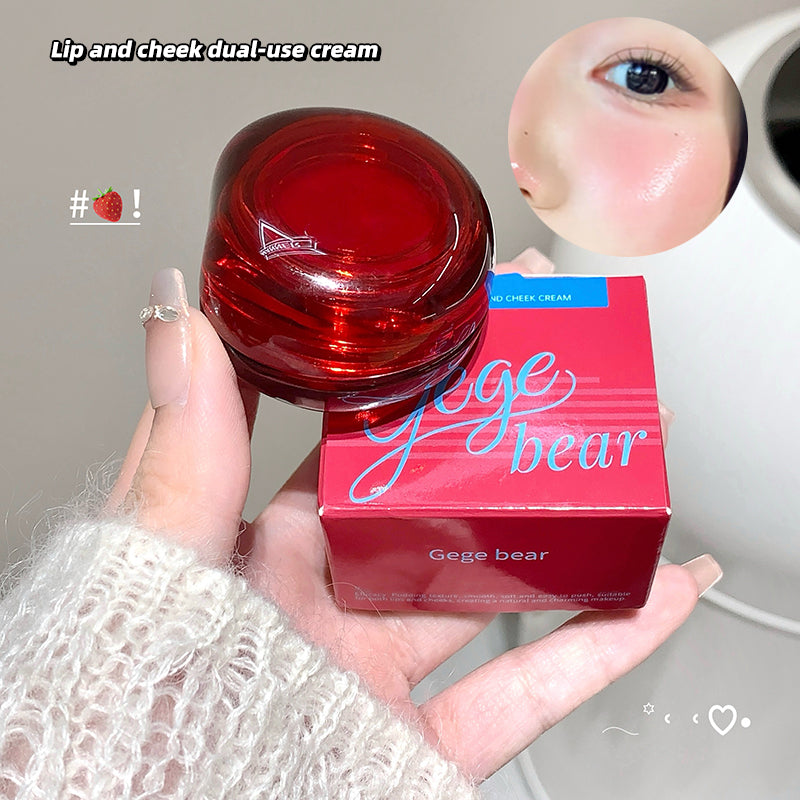 Red lip and cheek dual-use cream with Gege bear packaging held by a hand.
