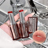 Three lipsticks held in a hand with a close-up of lips wearing the lipstick color, set against a blurred background.