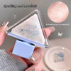 Hand holding a small triangular mirror with 'Bulgingbuling' branding, showing a close-up of the product.