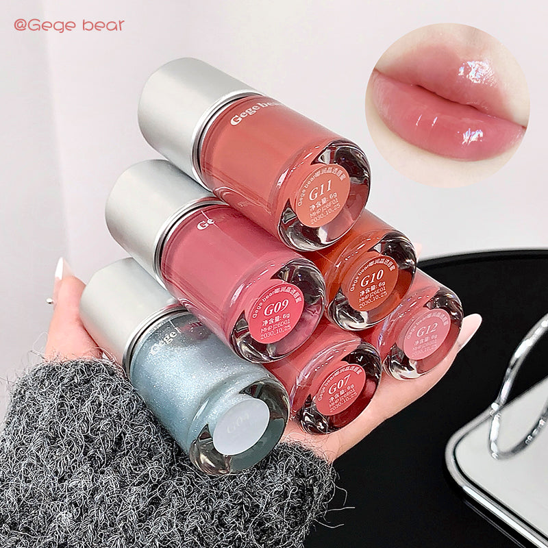 Set of nail polish bottles with a close-up of lips wearing a similar shade.