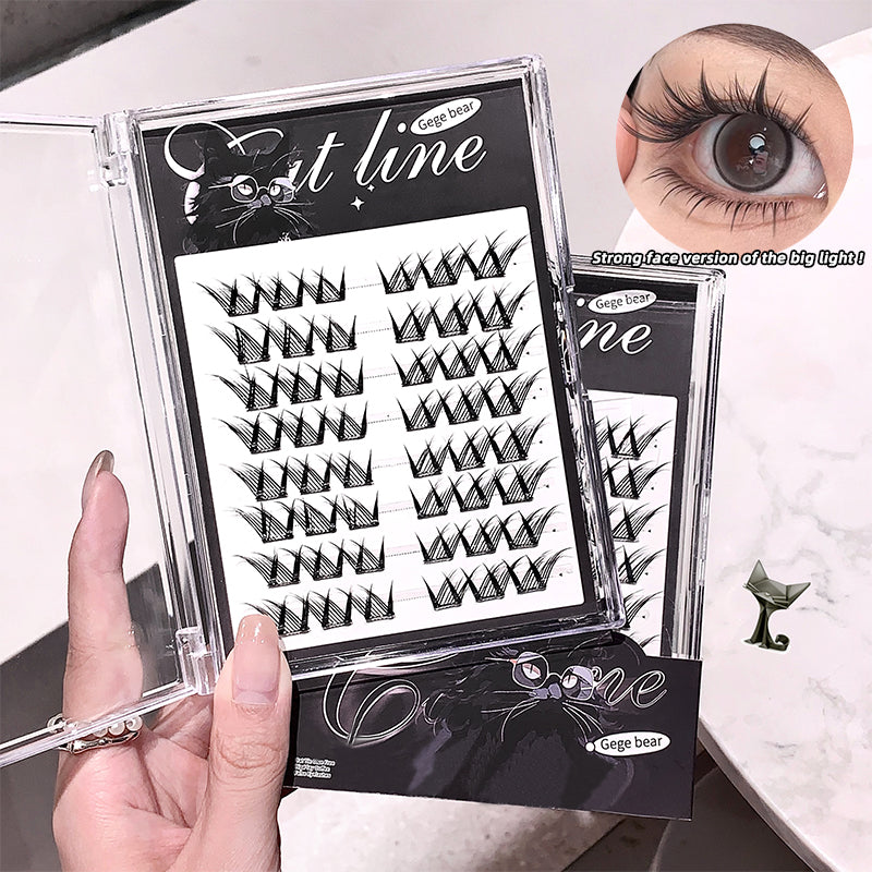 False eyelashes packaging with a hand holding it and an eye wearing the lashes.