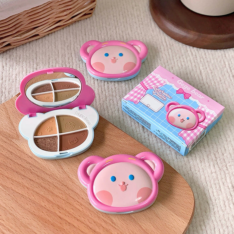 Makeup set with bear design on a wooden surface