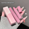 Pink lip gloss set with packaging held by a hand on a dark background