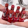 Set of red lipsticks in a holder with a hand holding it, text 'So beautiful!' above.