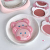 Pink bear-shaped containers on a white plate with a pink background