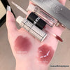 Lipstick with application on a hand, showing single and overlay coating.