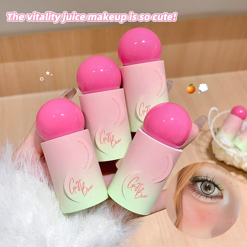 Pink and green makeup products with a hand holding them, set against a blurred background.