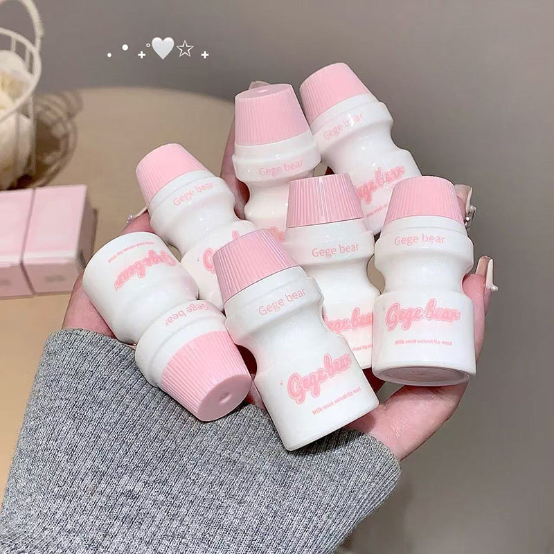 Hand holding multiple small white bottles with pink caps, featuring the brand 'Cige-line'.
