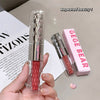 Lip gloss with pink shade held by a hand, next to its packaging labeled 'GEGE BEAR' on a magazine background.
