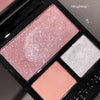 Makeup palette with pink, white, and peach shades on a dark background
