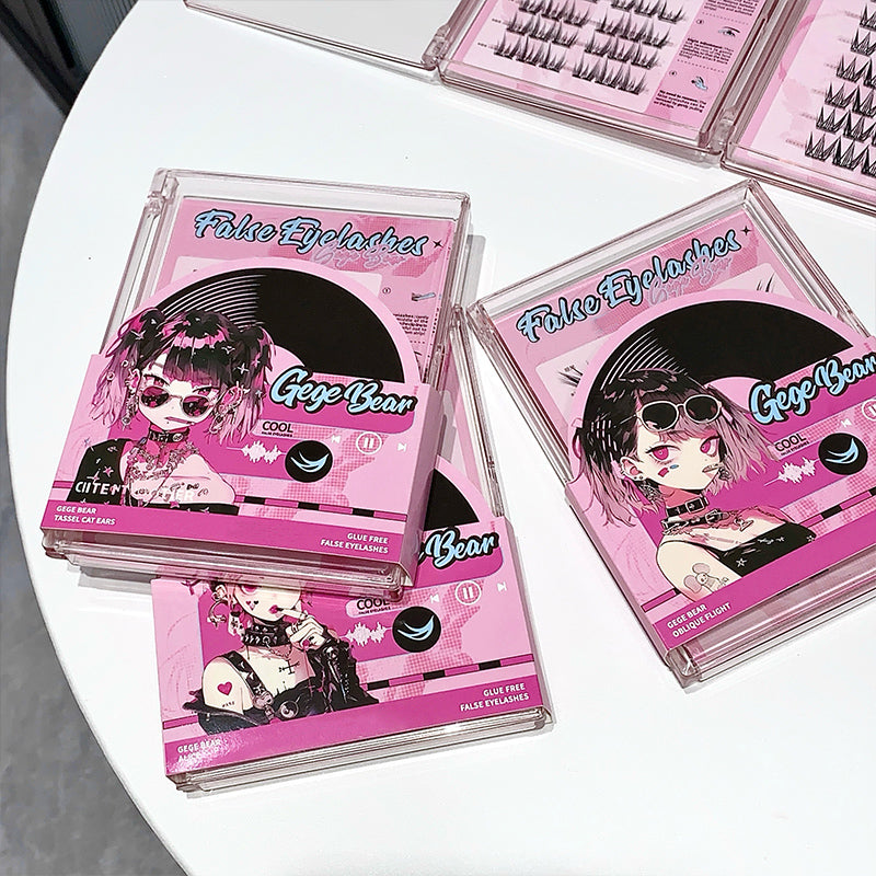 Pink packaging of false eyelashes with anime-style illustrations on a white surface.