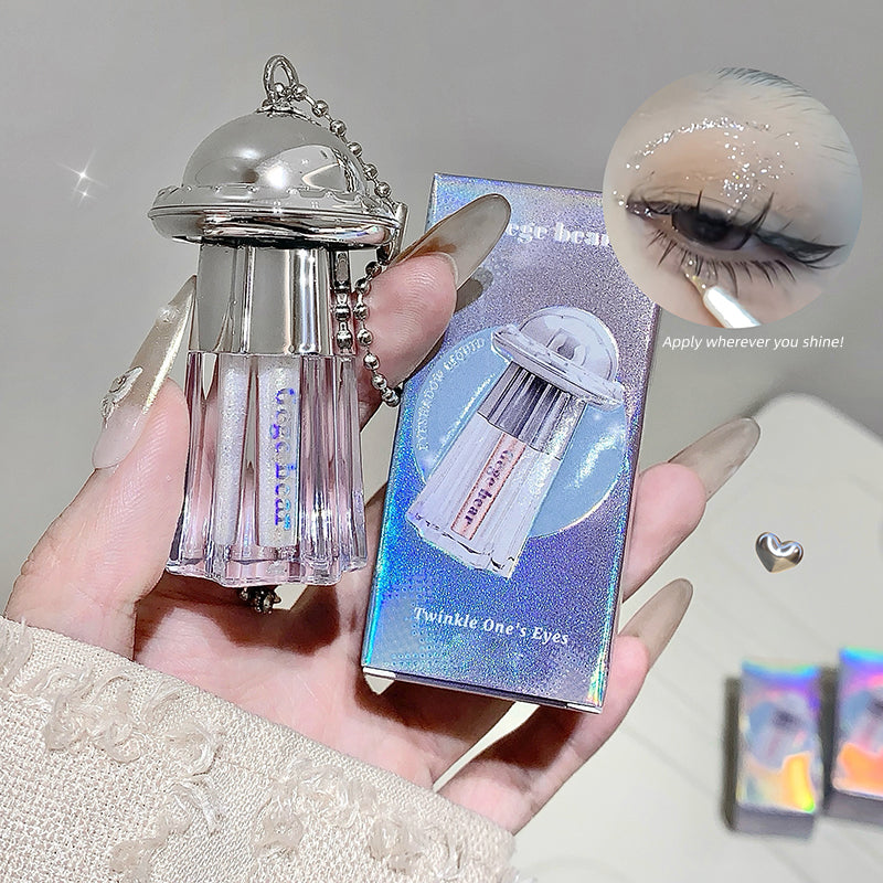 Eyelash product with packaging held in a hand, showing close-up of lashes.