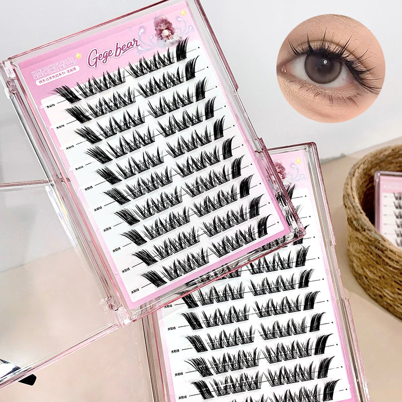 Set of false eyelashes with a pink case and an inset showing an eye wearing the lashes.