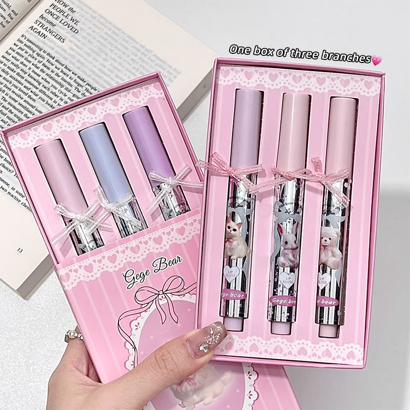 Set of three lip glosses in a pink box with 'Gegg Bear' branding.