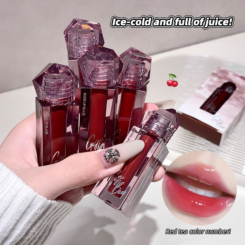 Red lip gloss with a hand holding it and a close-up of lips wearing the gloss.