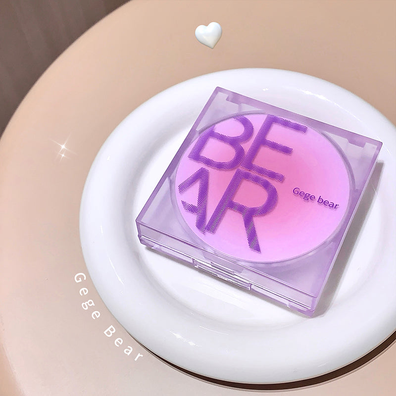Pink and purple compact mirror with 'Geege Bear' branding on a white plate.